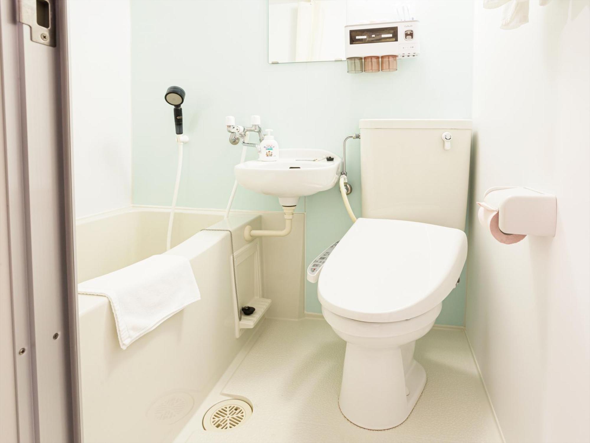 かりゆしコンドミニアムリゾート那覇スカイリビングホテル旭橋駅前 Naha Kamer foto